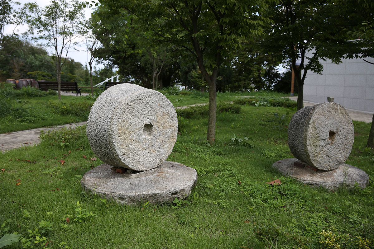 Outdoor exhibition area with folklore items